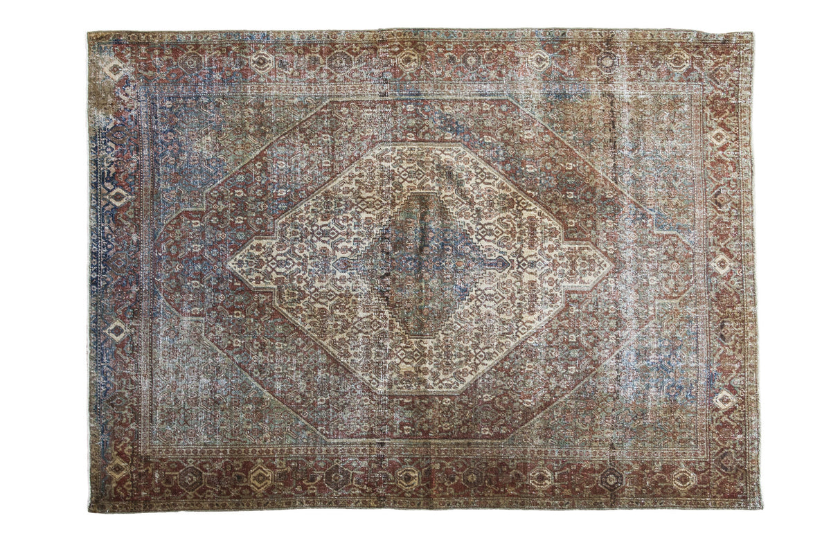 Distressed antique Senneh rug, overdyed royal blue and red rust medallion, 4'6" x 6'3".