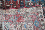Hand-knotted reverse of Antique Baktiary rug, displaying multicolor knots and red selvedge.