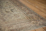 Faded large scale pattern and rich worn texture of a distressed Persian Mahal rug.
