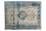 Vintage Karaja rug, triple medallions on ivory field, geometric patterns in aqua, navy, and tan.
