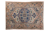 Vintage Serapi rug, stylized geometric medallion, softened terra cotta, ivory, deep blue, 4'6