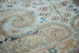 Vintage Sivas rug detail showing soft scrolling arabesques and subtle blossoming flowers.