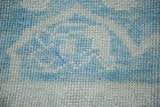 Hand-knotted pile of Vintage Oushak carpet featuring aqua seafoam and soft wheat large motif.