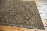 Bronze brown multi-medallion geometric pattern on a vintage Turkmen rug.