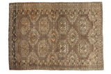 Vintage Turkmen rug with repeating bronze brown geometric gul and medallion patterns, 3x4 feet.