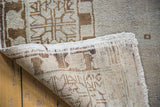 Hand-knotted foundation and fringed edge of a distressed Oushak runner.