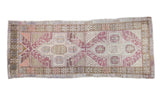 Distressed Oushak rug runner with geometric motif in plum, mauve, bronze, and ivory, 3'8