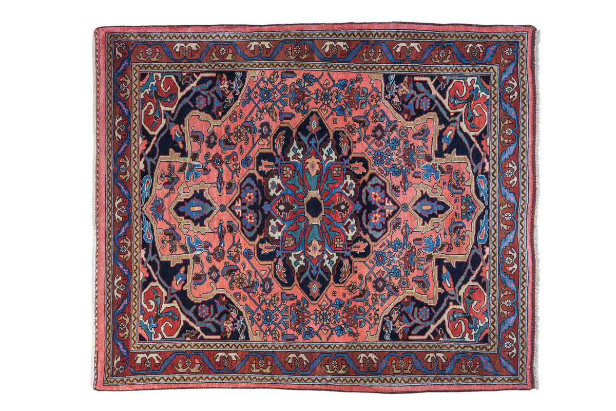 1930s Vintage Persian Bidjar rug: central medallion, light coral field, blue, green, red motifs. 4'2" x 5'.