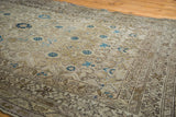 Intricate Herati design on vintage Malayer rug, with beige, gold, aqua, and navy tones.