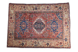Antique Karaja rug: brick red field, brilliant blue geometric patterns, unusual beige botanical border.