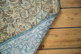 Vintage Sivas square rug's muted floral pile and patterned blue and beige foundation.