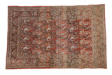 Distressed vintage Persian Birjand rug, faded red rust field with repeating paisley boteh motifs. 3'5
