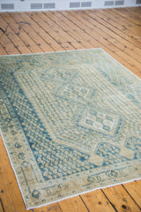 Vintage hand-knotted Afshar carpet corner, with geometric aqua and tan repeating botehs.