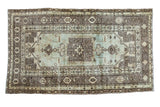 Vintage Turkish Oushak rug with seafoam green, silver, bronze stylized geometric medallion and border.