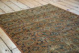 Intricate fine weave, distressed Turkmen Bokhara rug featuring rustic rust and teal patterns.