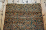 Fine distressed weave and intricate geometric patterns on an antique Turkmen Bokhara rug corner.