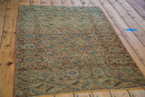 Intricate distressed geometric border and field patterns on this antique Tekke rug.