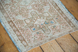 Vintage Persian Karaja runner detail: low pile, geometric ivory, coral, bronze, and blue accents.