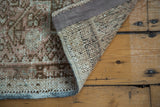 Vintage Karaja runner's hand-knotted backing, low pile, and ivory field geometric pattern.