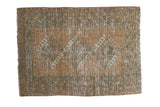 Distressed Afghan rectangular rug, faded copper field with triple gul medallions and teal ivory.