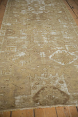 Distressed Oushak runner showing alternating bronze, ivory, and chocolate geometric patterns.