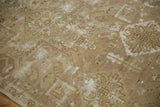 Distressed Oushak pile texture revealing bronze, ivory, and chocolate faded patterns.