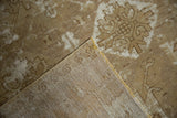 Distressed bronze and ivory vintage Oushak rug pile with tightly woven foundation.