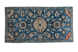 Antique Caucasian rug: deep indigo field, geometric patterns, blue and neutral tones. 2'11