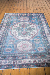Vintage distressed Caucasian carpet with low bristly pile and brilliant blue geometric pattern.