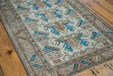 Intricate trefoil and serrated leaf motifs in brilliant indigo blue on a distressed Mehraban rug.