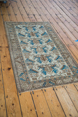 Vibrant indigo blue accents and distressed texture on a Mehraban rug corner.