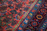 Vibrant Herati field, unique green band, and floral border on an antique Bidjar rug.