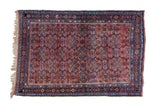 Antique Persian Bidjar rug with intricate allover Herati pattern in rich red, blue, and green.