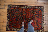 Classic Herati design with intricate renditioning in ruby red and deep blue, antique Engelas rug.