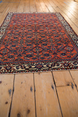 Exquisite detail of Herati pattern in brilliant gem tones on an antique Persian rug.