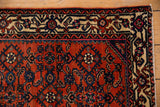Antique Engelas rug corner: intricate herati borders in cream, deep navy, and rich red.