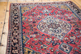 Josan Sarouk rug: intricate scrolling medallion, fine palmettes on soft cranberry red.
