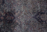 Distressed Sivas carpet pile, showing worn texture and muted blue, red, brown tones.