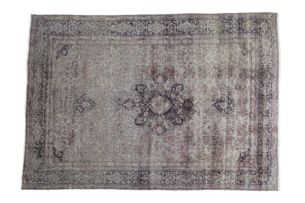 Distressed vintage Sivas carpet featuring an elegant muted medallion and faded floral patterns, 5'1" x 7'4".