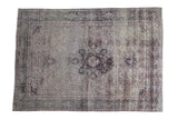 Distressed vintage Sivas carpet featuring an elegant muted medallion and faded floral patterns, 5'1