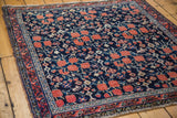 Guli Hannai Afshar rug's deep dark blue field, cinnabar red, ivory floral motifs.