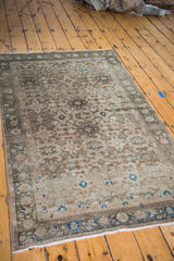Vintage Malayer rug corner with reciprocating star and samovar motifs, aqua accents.