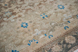 Textured vintage Malayer rug pile with repeating star and samovar motifs, aqua teal abrash.