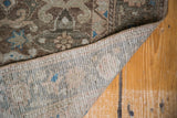 Vintage Malayer rug's tightly woven foundation and patterned pile with bronze, aqua, ivory tones.