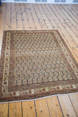 Antique Tabriz rug, silver field with repeating paisley botehs of germinating flowers.