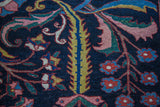 Intricate expressive floral and vine motif on a Baktiari rug with vibrant gem-tone colors.