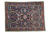 Antique Baktiari carpet with dark field, vibrant allover floral design, ruby red border, 5'3