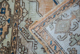 Soft, distressed texture of a Vintage Sivas rug featuring abrashed bronze, beige, and blue patterns.