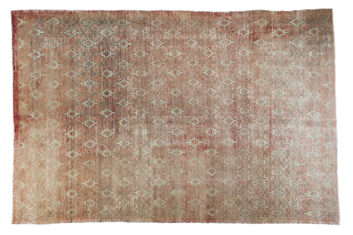 Vintage distressed Konya rug, coral rose red field, repeating small medallion pattern, 6'1" x 9'1".