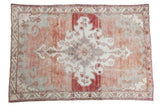 Distressed Oushak rug with abrashed cinnabar red field and cream, grey, mauve medallion design.